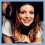 A pixelated image of a smiling woman with long brown hair, shown in three cropped views against dark backgrounds.
