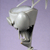 Pixelated grayscale image of a rounded object with a dark section below, suspended by two thin lines against a light purple background.