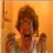 A pixelated static image shows a person with brown hair and an open mouth against an orange background, flanked by two smaller identical figures.