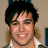 Pixelated image of a person with dark hair and a light-colored collared shirt, surrounded by orange text on a black background.