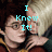 Pixelated image of a person with dark hair and glasses, split vertically into two color-toned halves, overlaid with cyan text reading "I Knew It!".