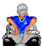 Pixelated avatar in blue sleeveless shirt and yellow chain smokes from a cigarette, seated on black-and-white checkered chair with gray pants.