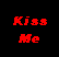 Pixel art animation frame showing two cartoon characters kissing with red text reading "Kiss Me" on a black background.