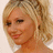 A blonde woman with styled hair and makeup smiles slightly, shown in four views with one blank