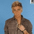 A pixelated image of a person in a brown shirt against a blue background, with yellow text on black reading 'justin thorne has my heart!' across four quadrants