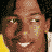 A static image with a yellow background featuring three pixelated headshots of the same person in white clothing, below which is bold black text reading "LOVE DON'T COST A THING".