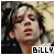 Pixelated close-up of a person with dark hair and closed eyes, wearing red lipstick against a blurred background with text reading 'BiLLY' at the bottom right.