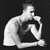 Black-and-white animation of a shirtless man in three poses: seated with arms crossed, leaning forward, and resting on one elbow.