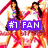 Two women in white tops and red skirts pose with arms raised against a red and white background, with a colored banner displaying "#1 FAN".