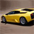 Yellow sports car with black roof and dark windows viewed from side, positioned on light brown background.