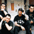 Static 48x48 pixel icon showing five stylized figures in black clothing with white accents against a blurred background, appearing to be a band photo with motion blur effects.