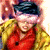 A pixelated image of a person with long blonde hair wearing red clothing and dark headwear, next to green text reading 'Original Icons .com' on a solid background.