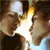Two people in profile view facing each other with a bright light between them, transitioning from closed eyes to open eyes.
