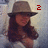 A person wearing a brown fedora and white top appears in four with changing red text overlays
