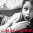 Pixelated grayscale image of a person in a white shirt holding a dark object, with red text at the bottom reading 'cut n' button'.