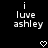 Black background with white pixelated text reading 'i luvve ashley' and a small heart symbol below the text.