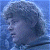 A split-frame contact sheet showing a pixelated character portrait on the left and green text logo on the right against dark background.