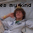 Pixelated image of a person with brown hair wearing a white shirt and green undershirt, extending an arm forward while text above reads 'es my kind' in black block letters.