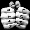 Two clenched fists face each other with black runes on white knuckles against a black background.