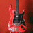 A split-screen animated buddy icon featuring a red electric guitar on the left and green text reading "Original Icons .com" on the right against contrasting backgrounds.