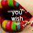 A mouth with multicolored lips displays sequential text: 'you wish', then 'you had', and finally 'lips like these!'.