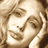 Pixelated static image of a person's face with light brown and beige tones, showing partial facial features including eyes, nose, mouth, and hair in low-resolution detail.