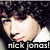 A pixelated image of a person with curly hair wearing a white shirt, featuring text overlays and visible animation changes.