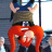 Pixelated static image of a cartoon character with red hair, blue top, and brown pants in mid-action pose against dark background.