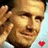 Pixelated image of a smiling man with short dark hair, wearing a white shirt, next to cyan background with pink text reading "I LOVE BECKHAM" and a small red heart symbol.