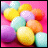 Pixelated static image of colorful pastel balloons against a pink background with subtle gradient transitions and soft highlights.