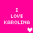 Pixelated text "I LOVE KAROLINA" on bright pink background with white and light pink heart symbols.