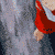 A character with silver hair and red clothing appears in a sequence of animated poses showing movement from standing to crouching.