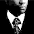 Static black-and-white pixelated icon showing a partial face with prominent white ear-like shapes and dark facial features against a solid black background.