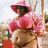 Pixelated image of a person in pink clothing with green text reading 'how you doin'?' on a black background.