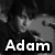 Four- black-and-white image with text overlays: 'Adam', 'Gontier', 'is', and red 'LOVE!' in pixelated font