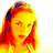 Pixelated image of a person with long hair, closed eyes, and hand near face in warm yellow-orange-red tones.