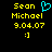 Yellow pixelated text 'Sean Michael 9.04.07 :] ' on black background with cyan heart symbol above 'Michael' in left , identical right without heart