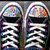 Two side-by-side pixelated icons with white text on dark backgrounds, each topped with a colorful, blurred circular pattern.