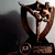 Animated trophy icon with bronze-colored figures in dynamic pose, base with circular emblem, red text overlays changing between frames.