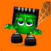 Green cartoon character with black boots and a black headpiece stands against an orange background with a white web pattern.