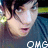 A pixelated image of a person with dark hair wearing a dark blue shirt, with the text "OMG" in white at the bottom.