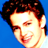 Pixelated close-up of a person's face with dark hair against a solid blue background, rendered in low-resolution 256x256 pixels.