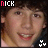 nine identical pixelated images showing a person with dark curly hair, light skin, and a pink shirt against a black background