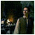 A man in a dark robe stands before a fireplace with flickering flames, the scene transitions from dim to bright lighting