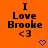 Orange background with black text reading "I Love Brooke <3" and a blue pixelated heart below the text.
