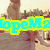 Pixelated image with cyan text 'lopeMo' on yellow background, partially obscured figures in background, muted brown and beige tones.