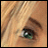 A 48x48 pixel buddy icon featuring a close-up of an eye with green irises and brown eyelashes on the left, paired with stylized text reading "Anime IM" above smaller "COM" text on a black background to the right.
