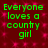 Green text reading 'Everyone loves a country girl' on a dark red background with pink star-like patterns, displayed in a
