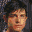 Four pixelated headshots of a person with dark hair against varying backgrounds including blue, white, and brown tones.