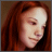 Static 48x48 pixel buddy icon showing a close-up of a person with long brown hair and light skin tone, rendered in low-resolution pixel art style with visible dithering and color blending.